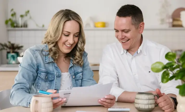 MyBudget clients Erin and Adam celebrating success after using budget planning for bills and achieving financial goals in New Zealand.
