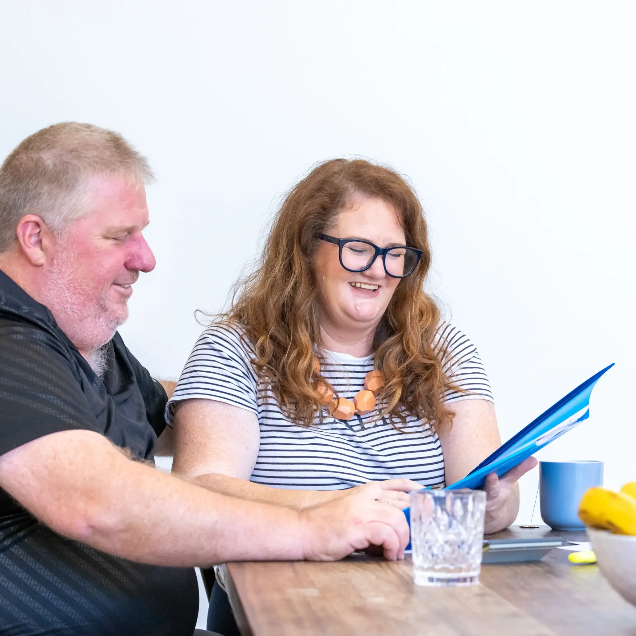 MyBudget clients Alyssa and Pete organising bills with a dedicated debt management plan and budget planning in New Zealand.
