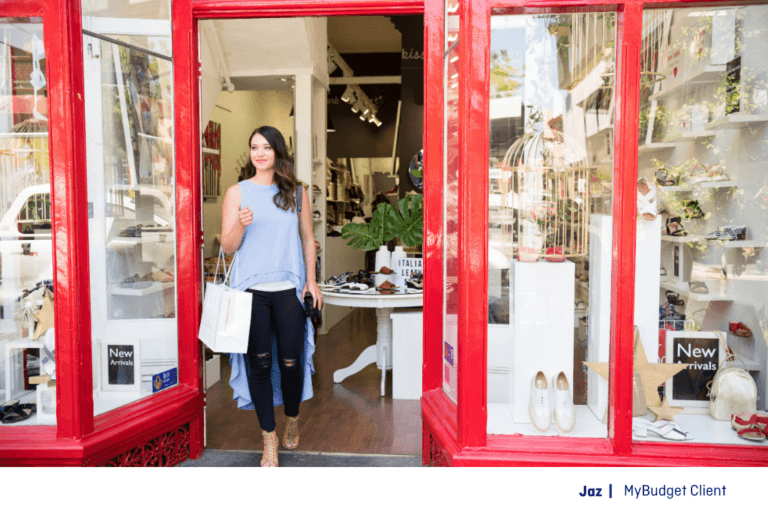 MyBudget client Jaz leaving a clothing store after shopping within her budget and spending plan
