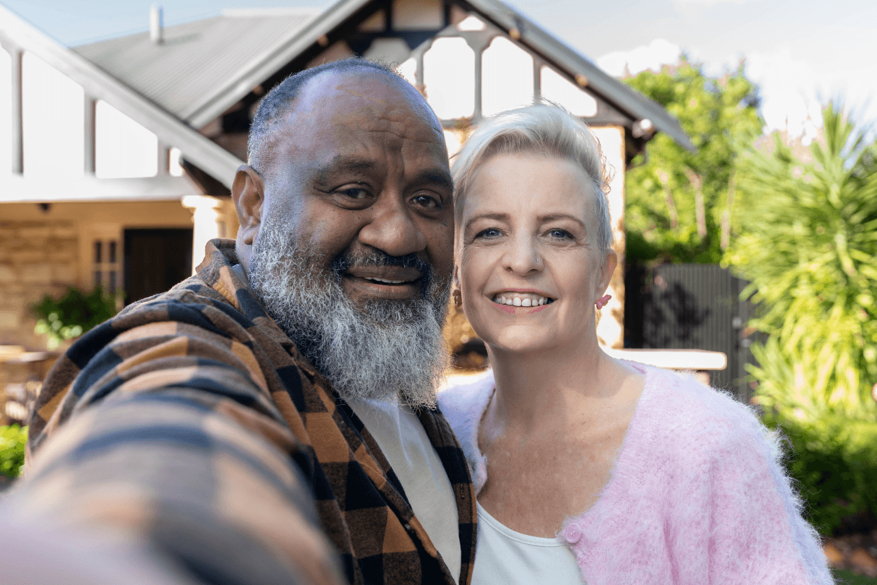 Kim and Bob taking a selfie after achieving their financial goals with MyBudget, showing how New Zealanders can enjoy greater financial confidence.